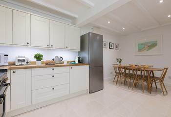 Beautifully designed, the kitchen is well-equipped with everything you could need and more!