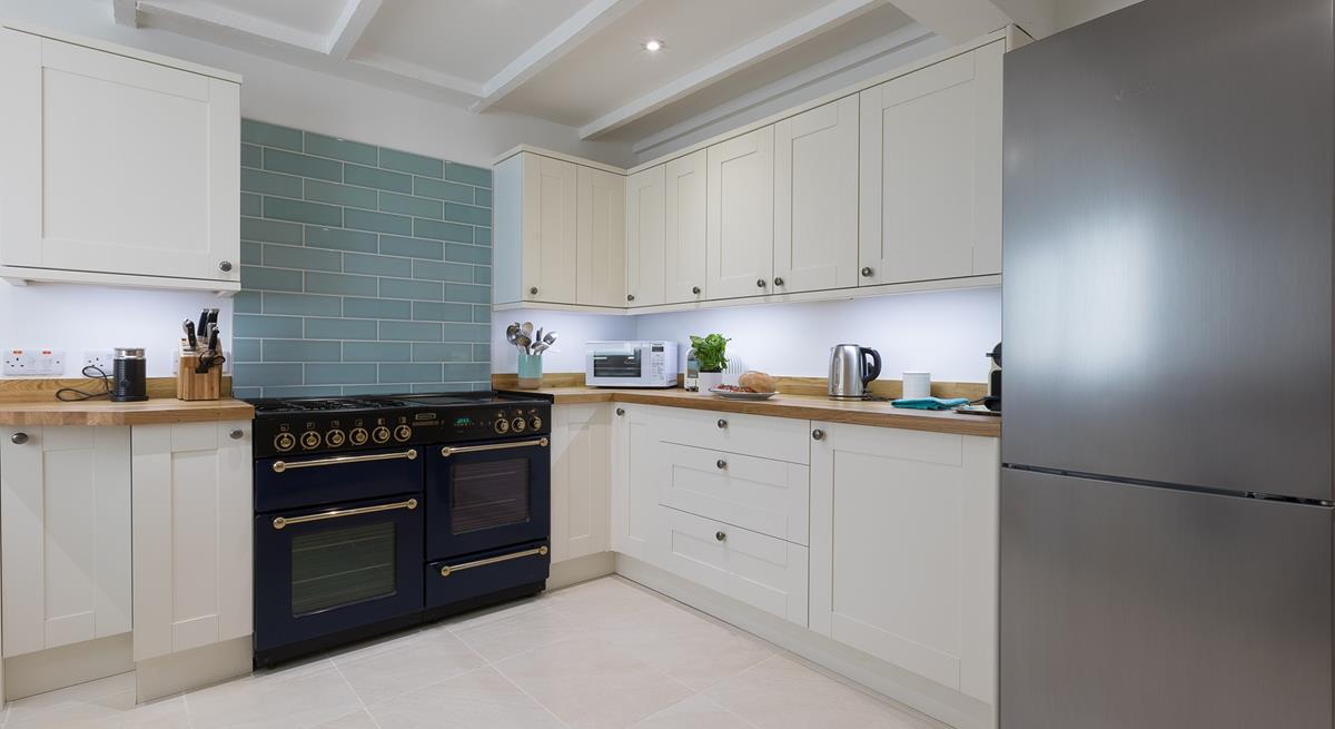This gorgeous kitchen is sure to delight any budding chef!