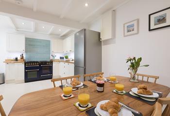 The kitchen/dining area offers ample space for families to enjoy meals together and make lasting memories. 