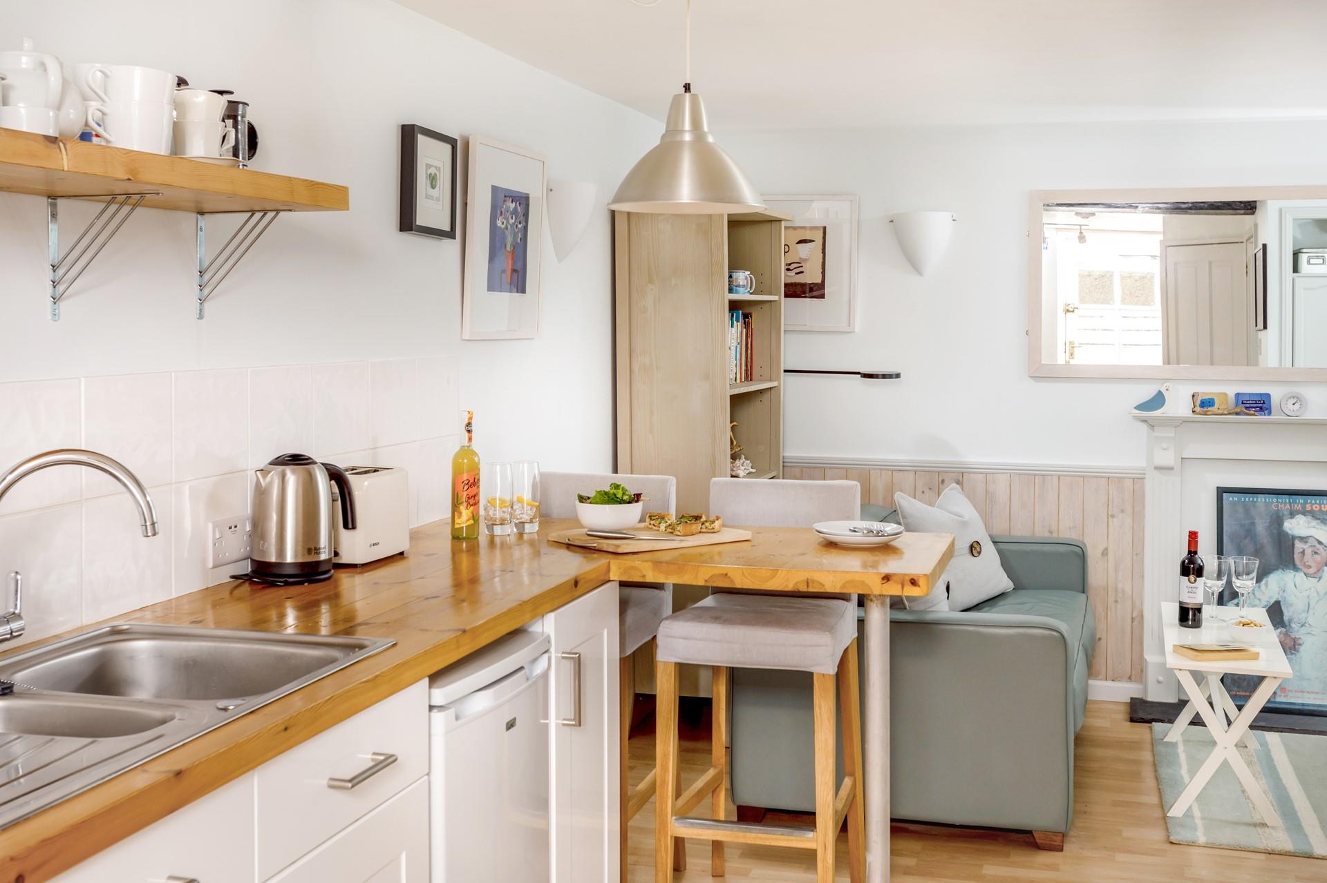 The cosy living space is stylishly decorated with a welcoming and homely vibe.