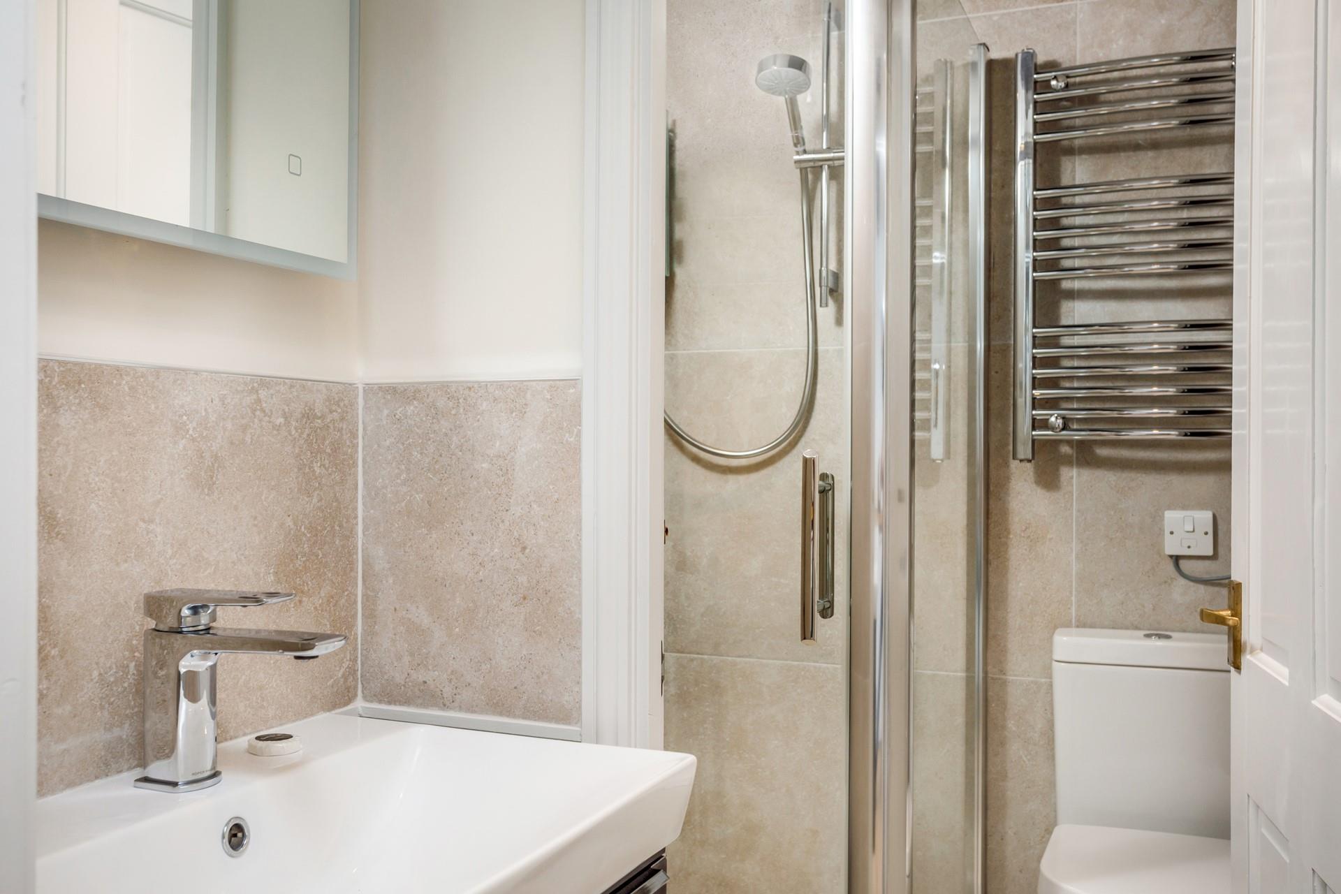 After a day at the beach wash away the sand but not the memories in the sleek bathroom.