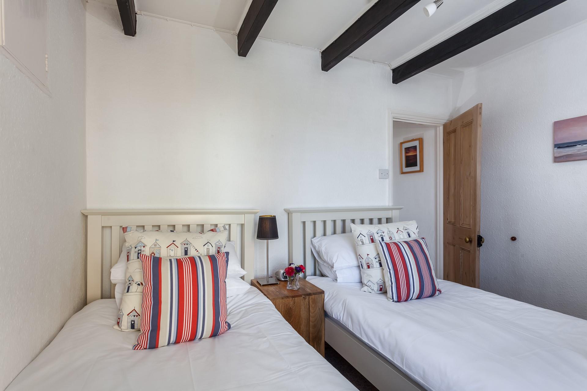 The twin room with its fun seaside decor is perfect for children!