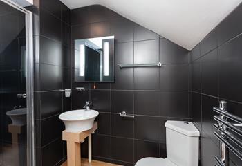 The master bedrooms en suite is a sleek space, fantastic for starting your day with an invigorating shower.