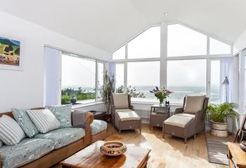 Large windows have created a bright and airy space, perfect for watching the waves no matter the season.