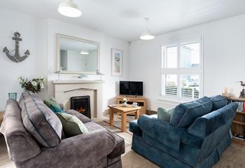 Cosy sitting room on the ground floor, along with the kitchen and conservatory. 