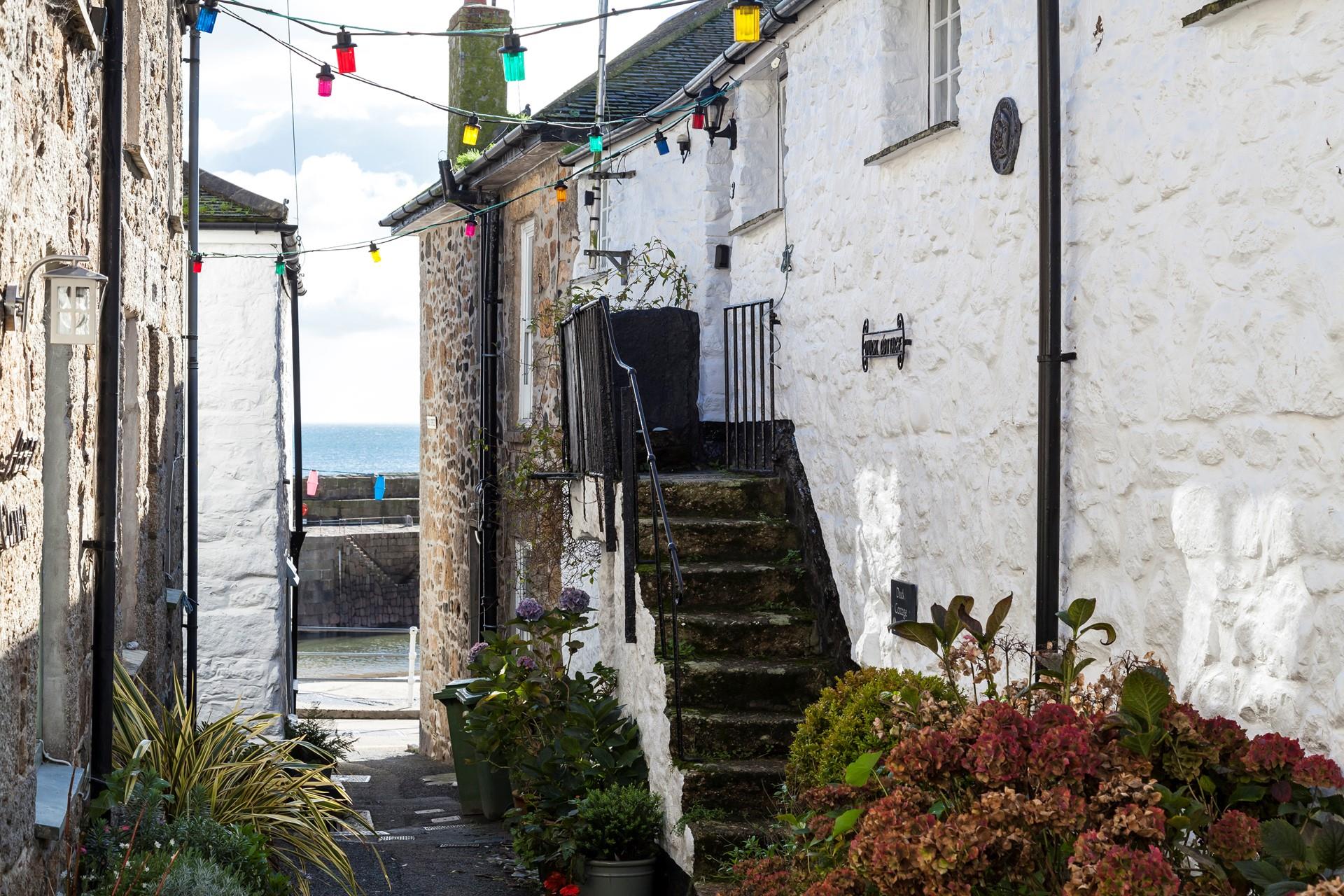 You are just a few steps from the picturesque Mousehole Harbour where you can see fishing boats bobbing up and down at high tide. 
