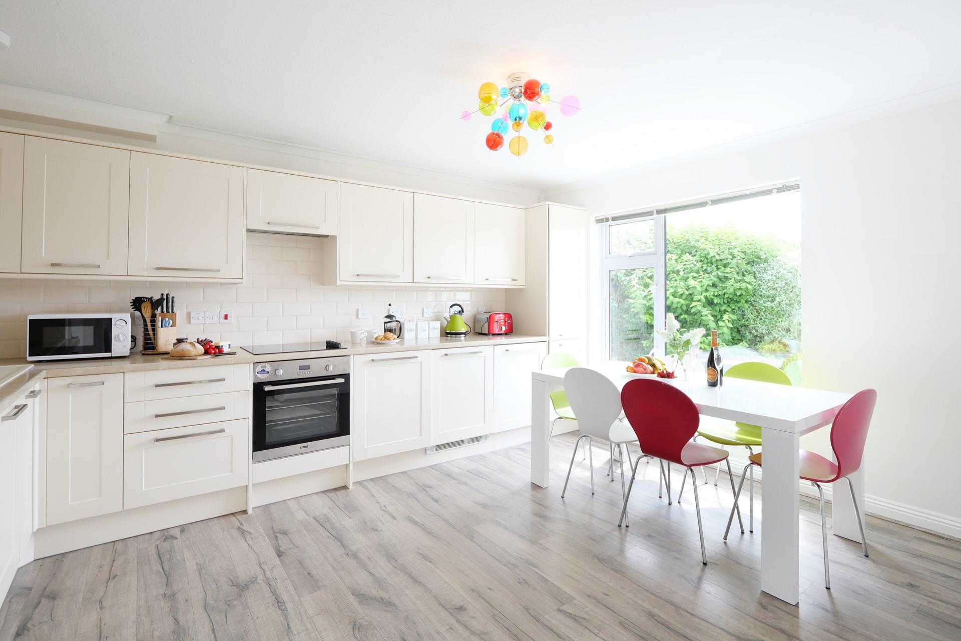 The well-proportioned kitchen/dining room is ideal for family meals together.