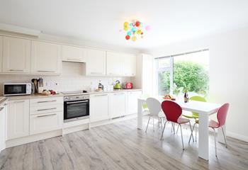 The well-proportioned kitchen/dining room is ideal for family meals together.