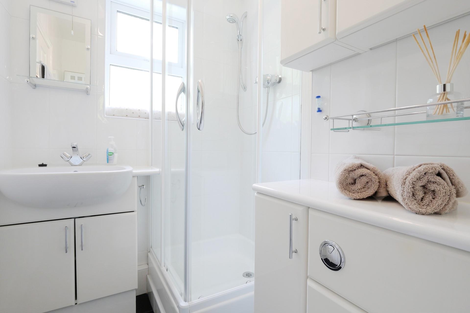 Wash off sandy toes and salty skin in the shower after a day on Summerleaze Beach.