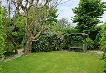 The secluded garden is the perfect space to relax and unwind in the sunshine. 