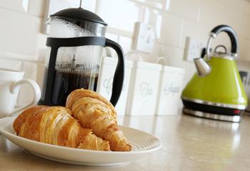 Start the day with warm pastries and fresh coffee.