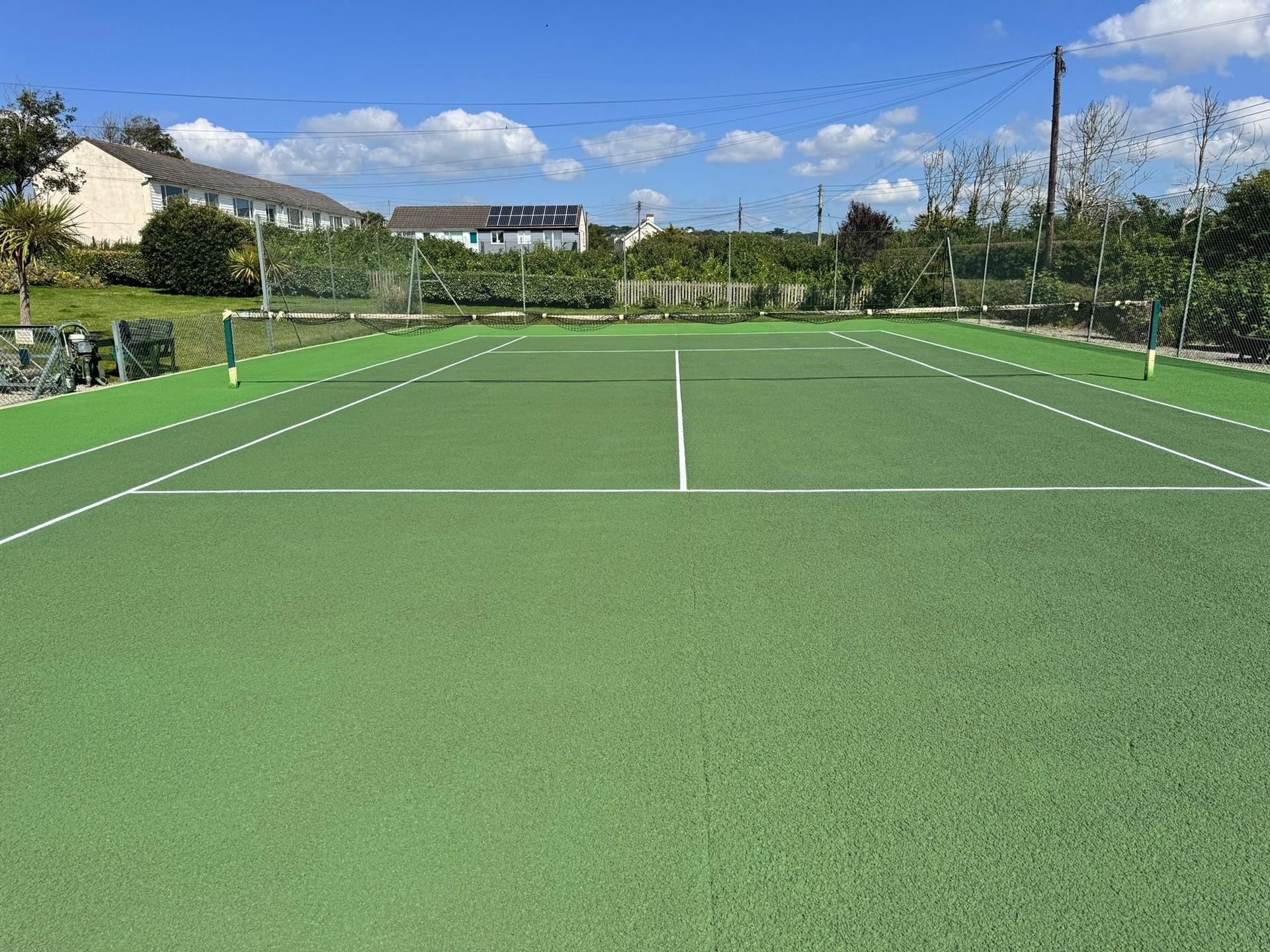 The communal tennis courts are a great way to stay active on holiday!