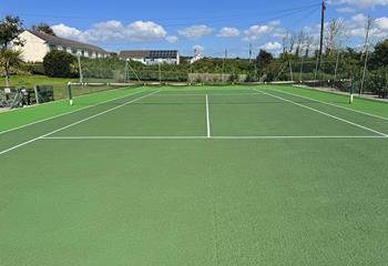 The communal tennis courts are a great way to stay active on holiday!