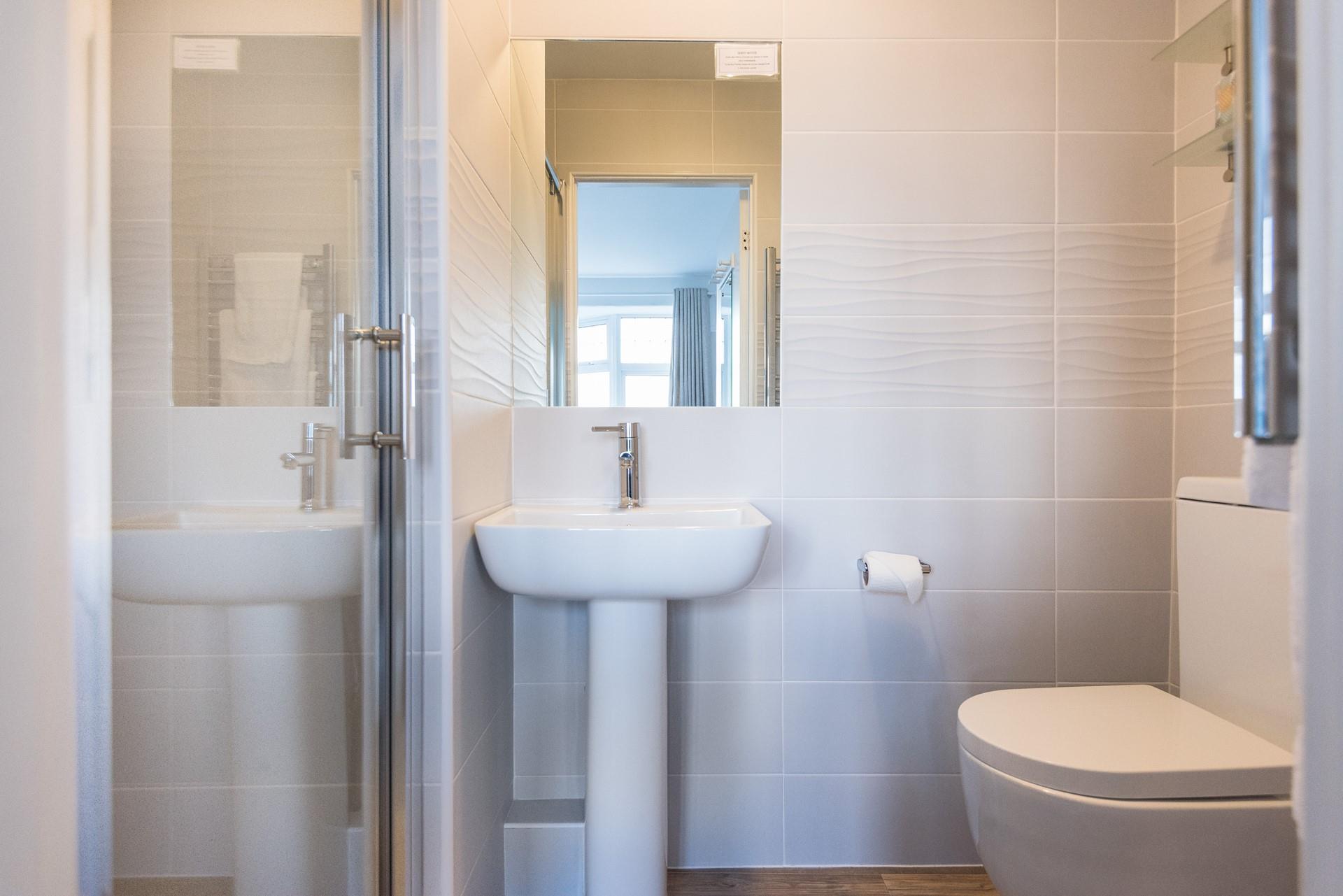 The en suite is simple yet stylish.