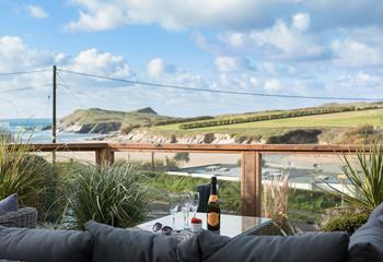 Relax on the sun deck, with views across Porth beach to Porth island.