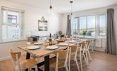 Get the family together over a delicious dinner in the stylish dining space. - Thumbnail Image