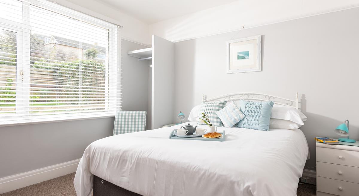 Light and airy, with views of Porth beach and its own en suite. 