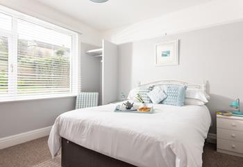 Light and airy, with views of Porth beach and its own en suite. 