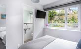 Bedroom 4 has lovely garden views and another handy en suite. - Thumbnail Image