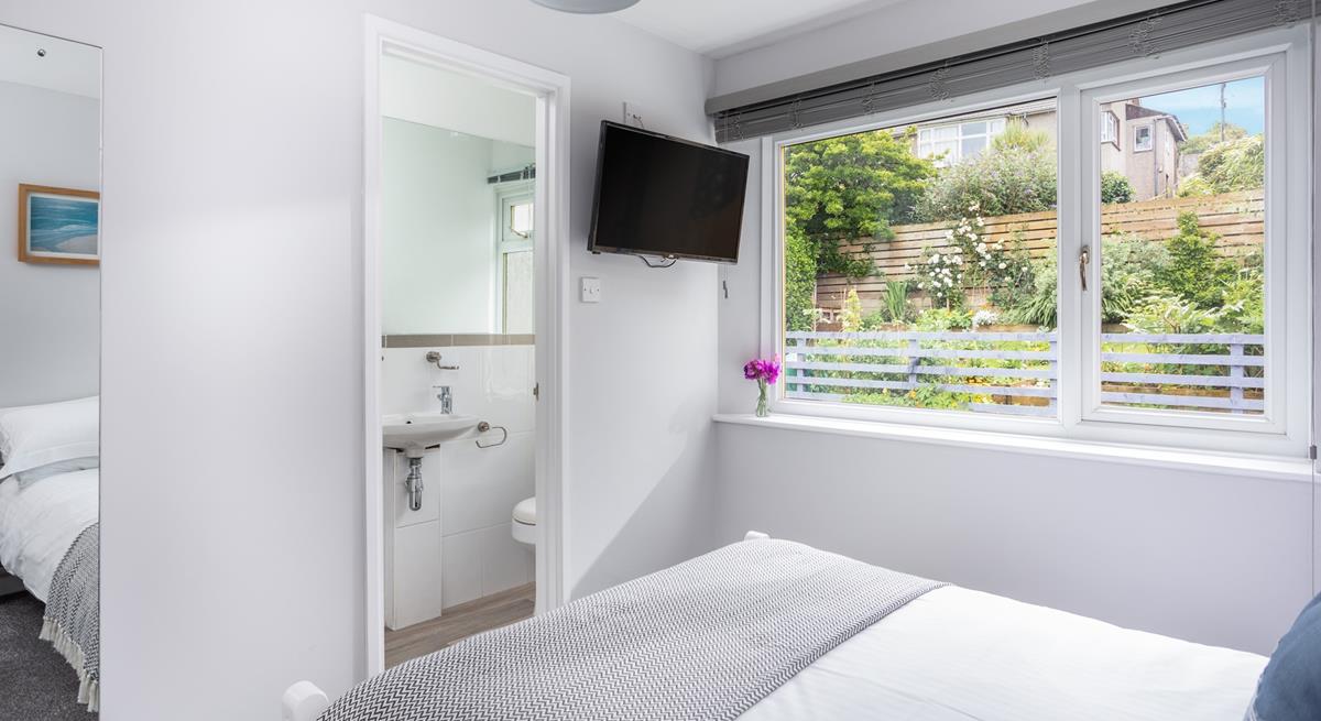 Bedroom 4 has lovely garden views and another handy en suite.