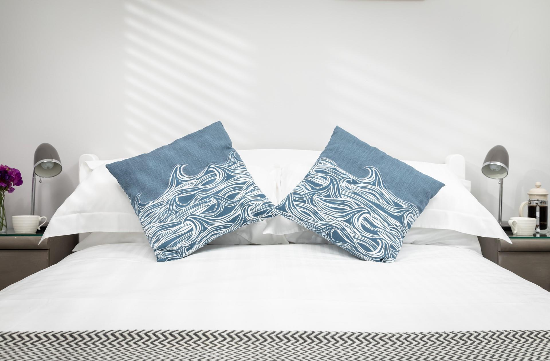Soft, blue tones have created a calming oasis that is sure to help you relax and drift off to sleep.