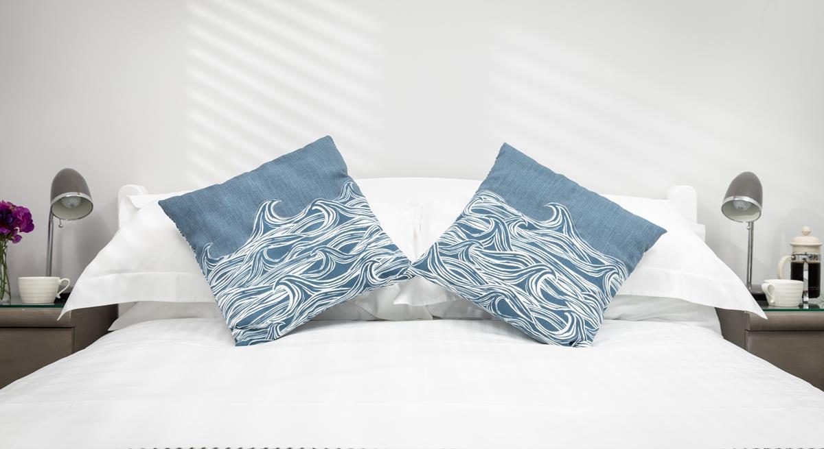Soft, blue tones have created a calming oasis that is sure to help you relax and drift off to sleep.