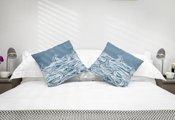 Soft, blue tones have created a calming oasis that is sure to help you relax and drift off to sleep.