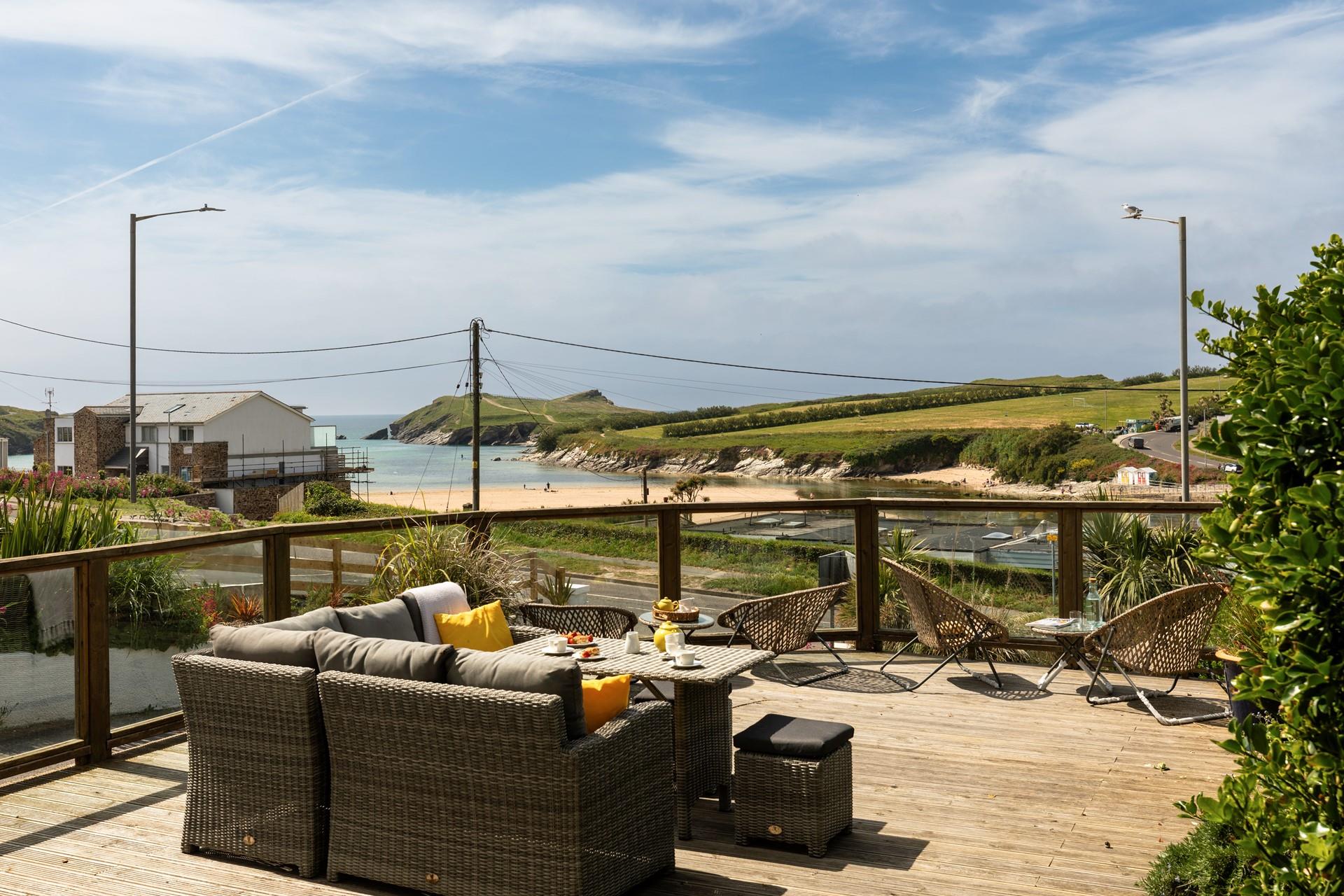Relax on the sun deck, with views across Porth beach to Porth island.