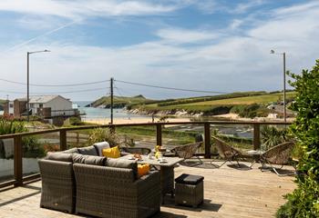 Relax on the sun deck, with views across Porth beach to Porth island.