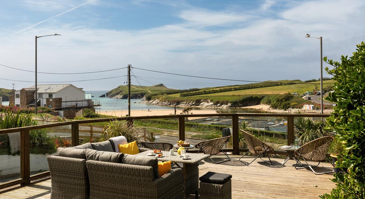 Relax on the sun deck, with views across Porth beach to Porth island.
