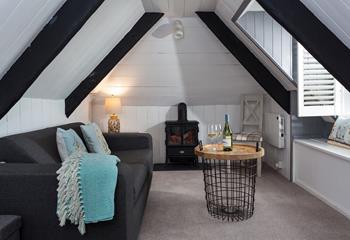 The attic area has a cosy sofa bed and sea views.