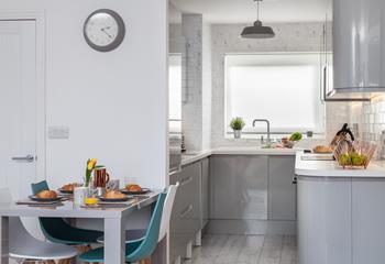 Enjoy breakfast in this modern and sleek kitchen/diner.