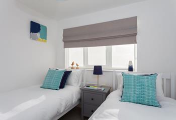 Bright and spacious, bedroom 2 features twin beds. 