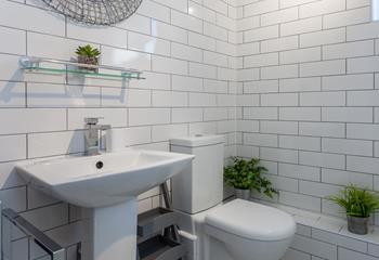 Modern and stylish, the bathroom is tastefully finished. 