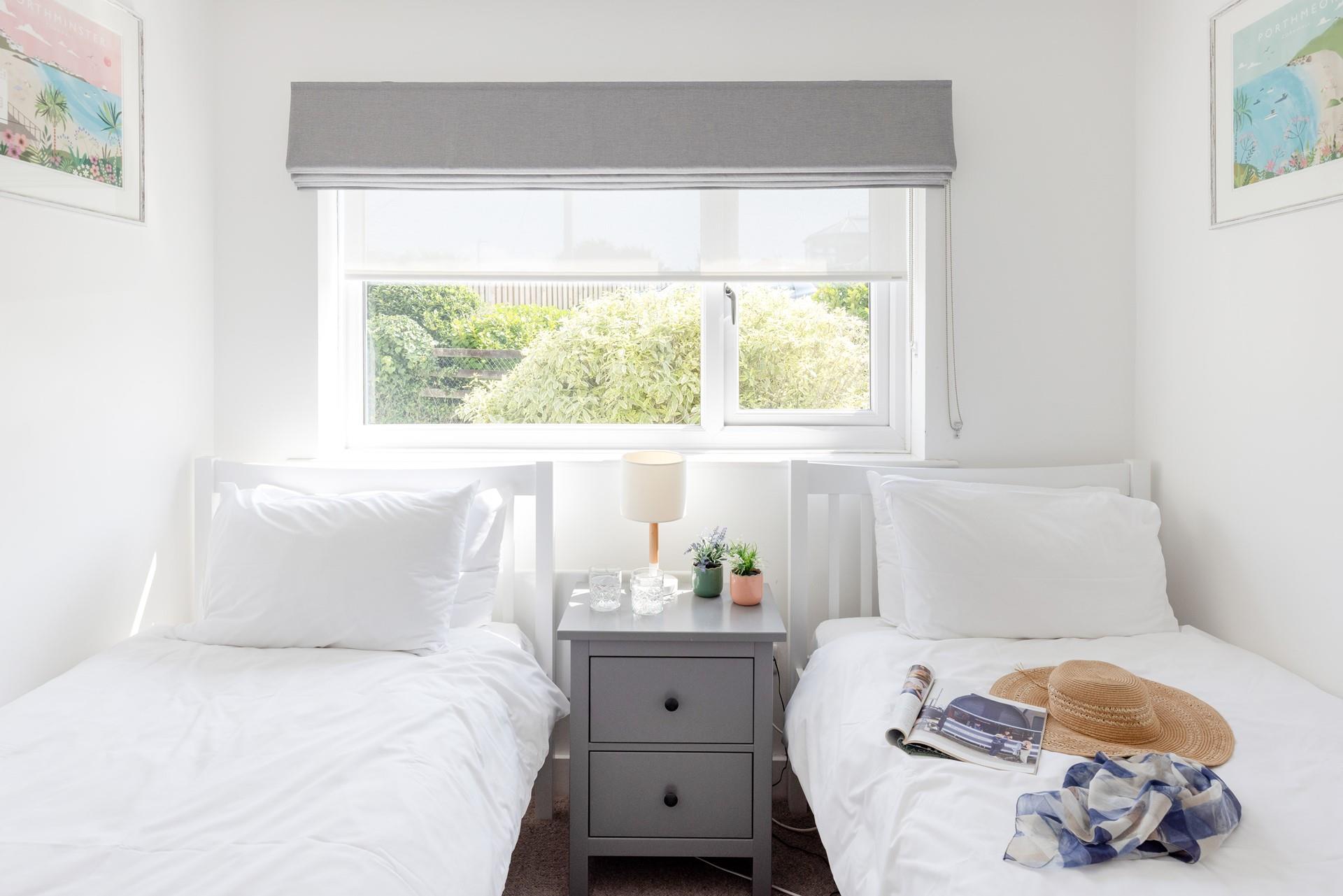 Bright and spacious, bedroom 2 features twin beds. 