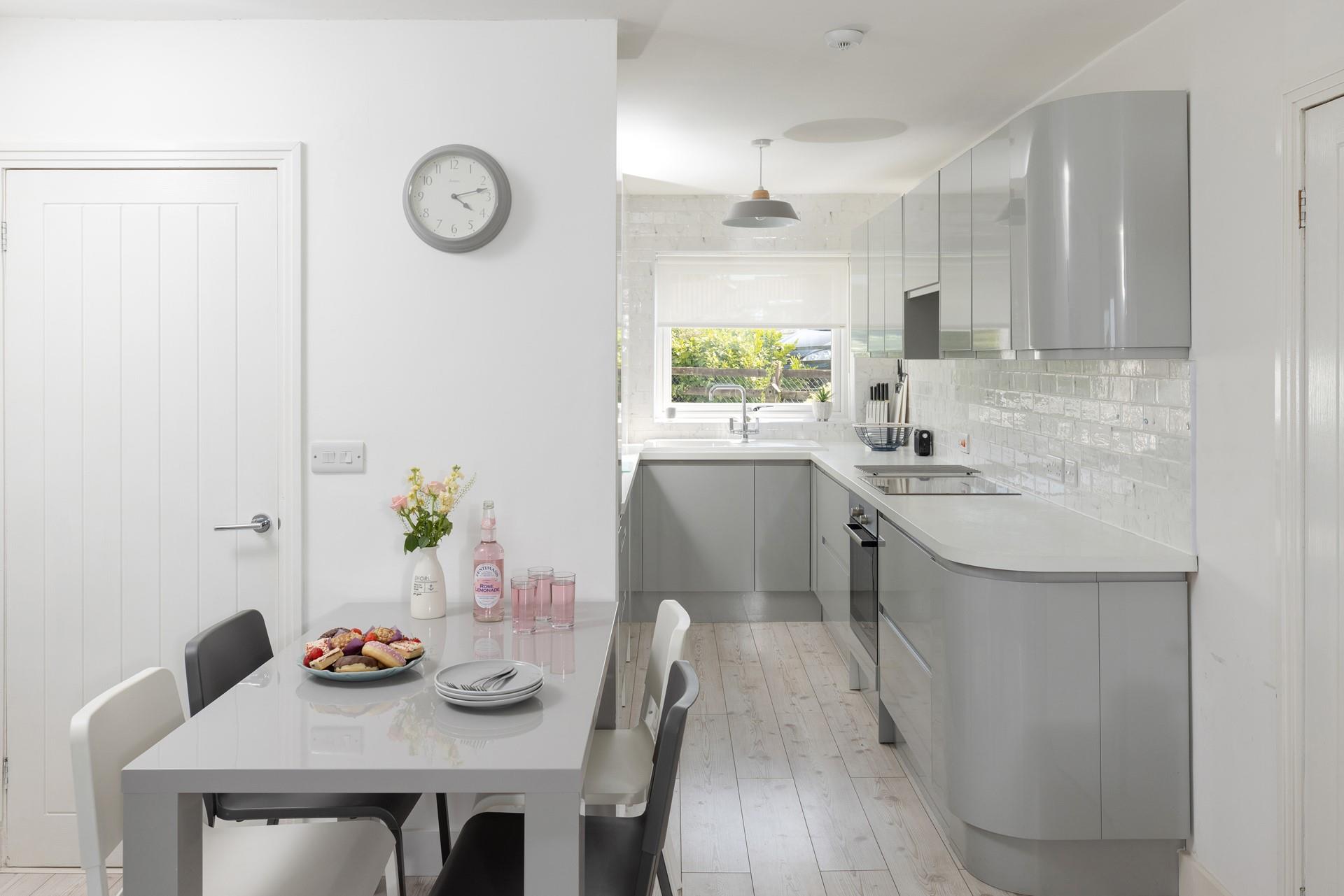 Enjoy breakfast in this modern and sleek kitchen/diner.