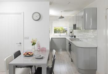 Enjoy breakfast in this modern and sleek kitchen/diner.