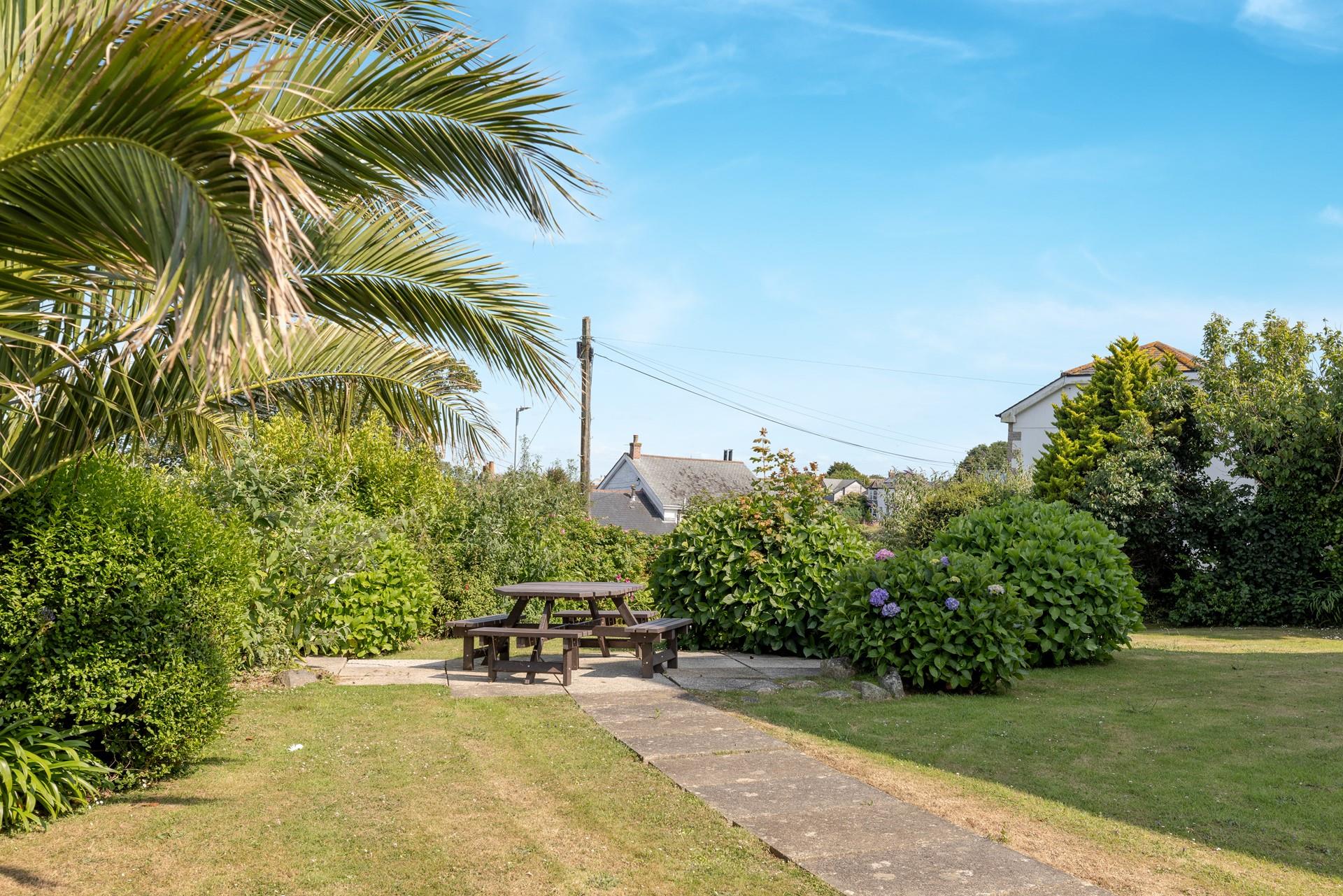 Soak up the evening sun in the garden with a glass of something cold.