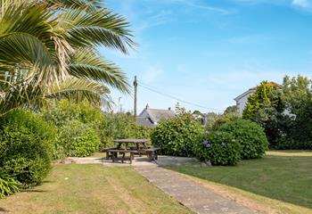 Soak up the evening sun in the garden with a glass of something cold.