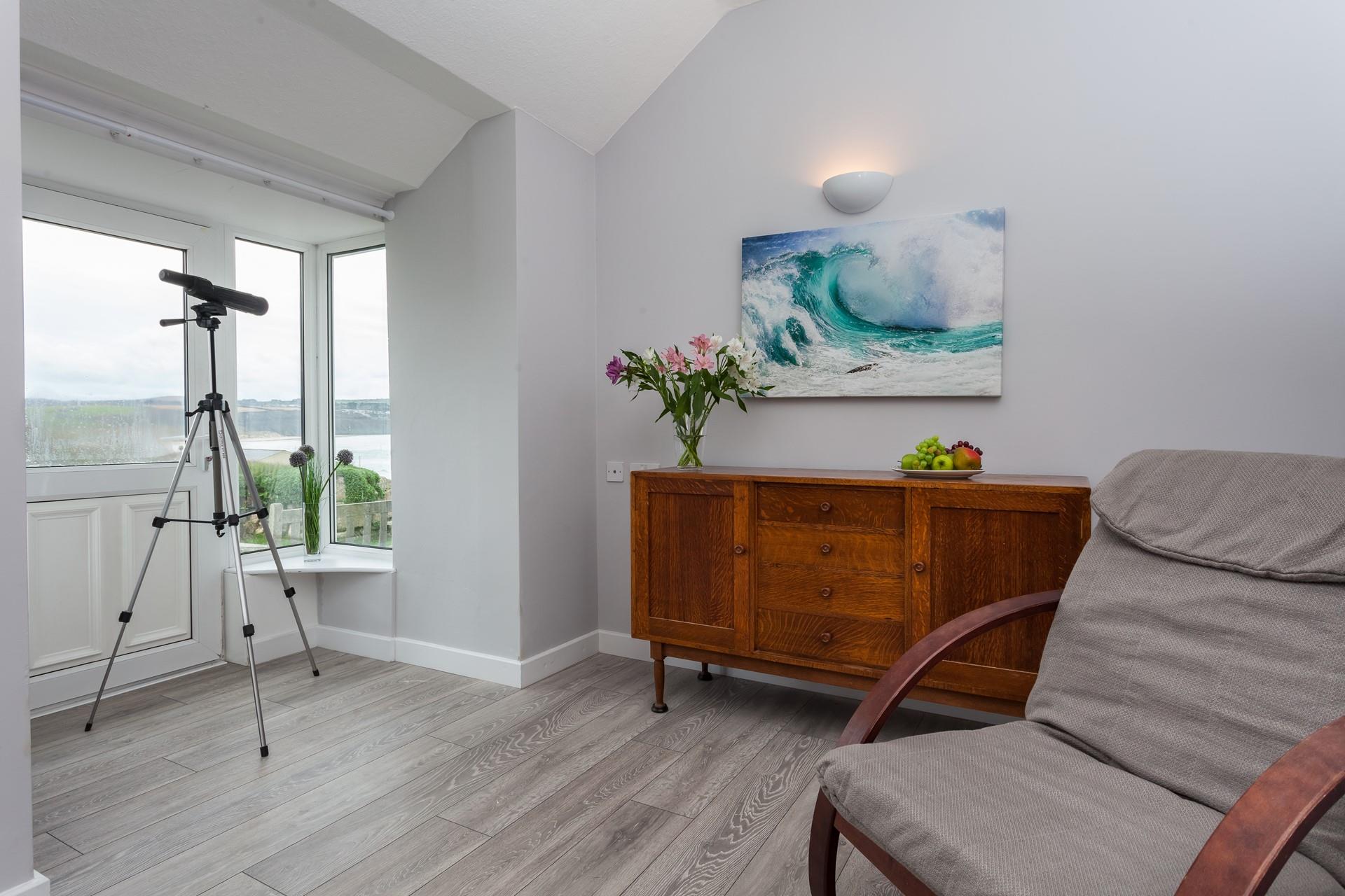 Relax in front of the window overlooking the sea and spend the evening wave watching.