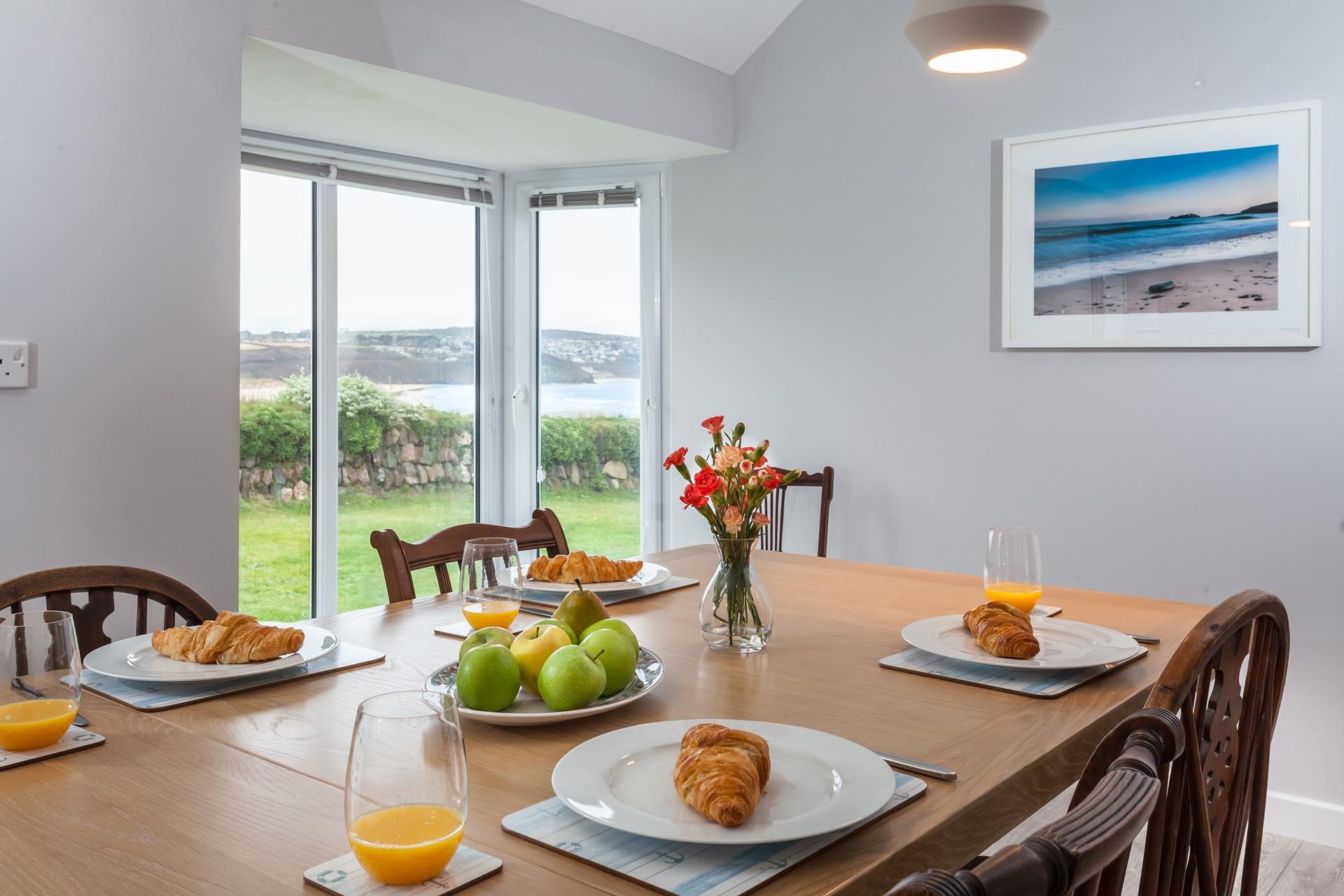 Sit around the table for breakfast before heading out for a day spent relaxing on the beach.