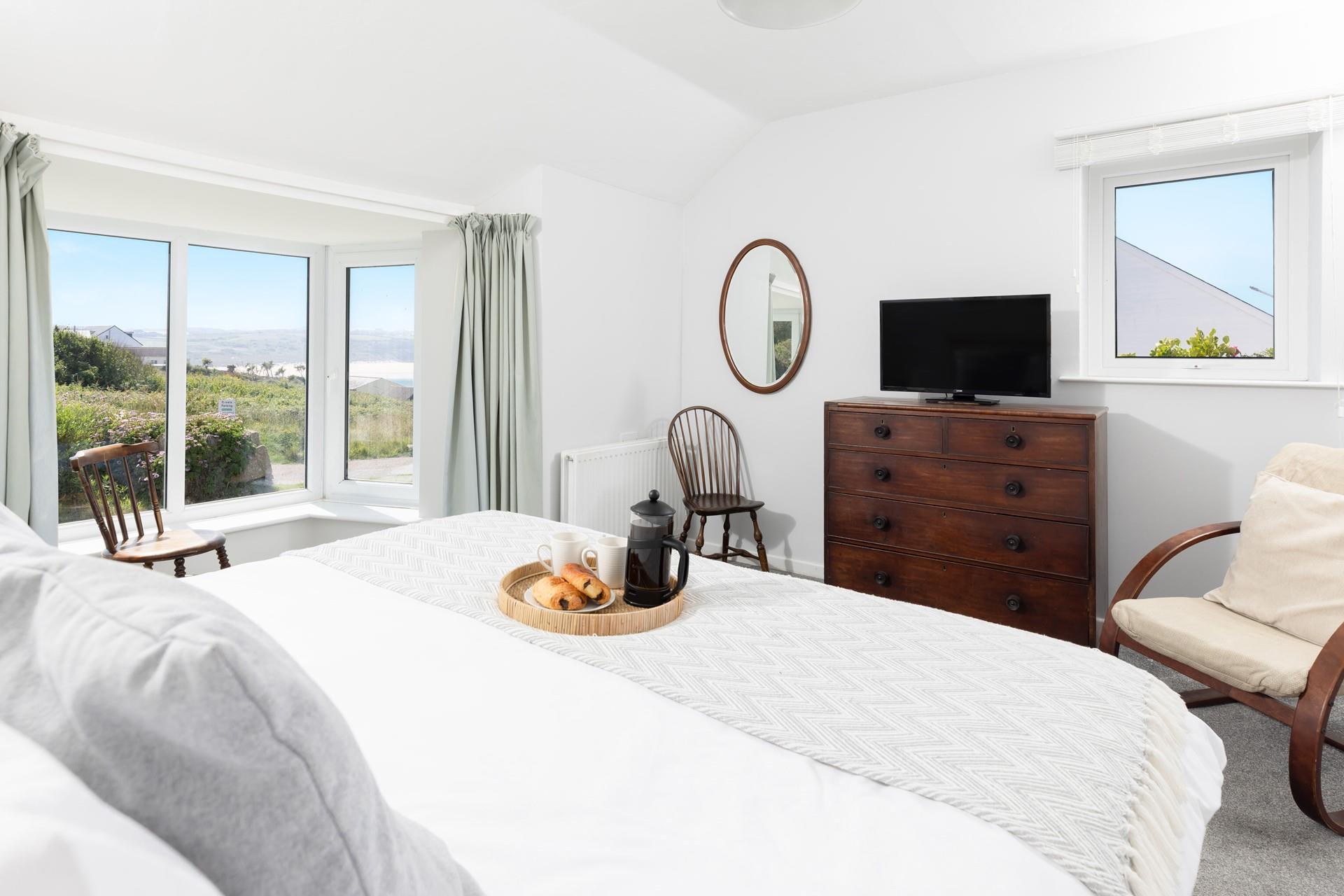 Wake up to beautiful beach views in bedroom 4.