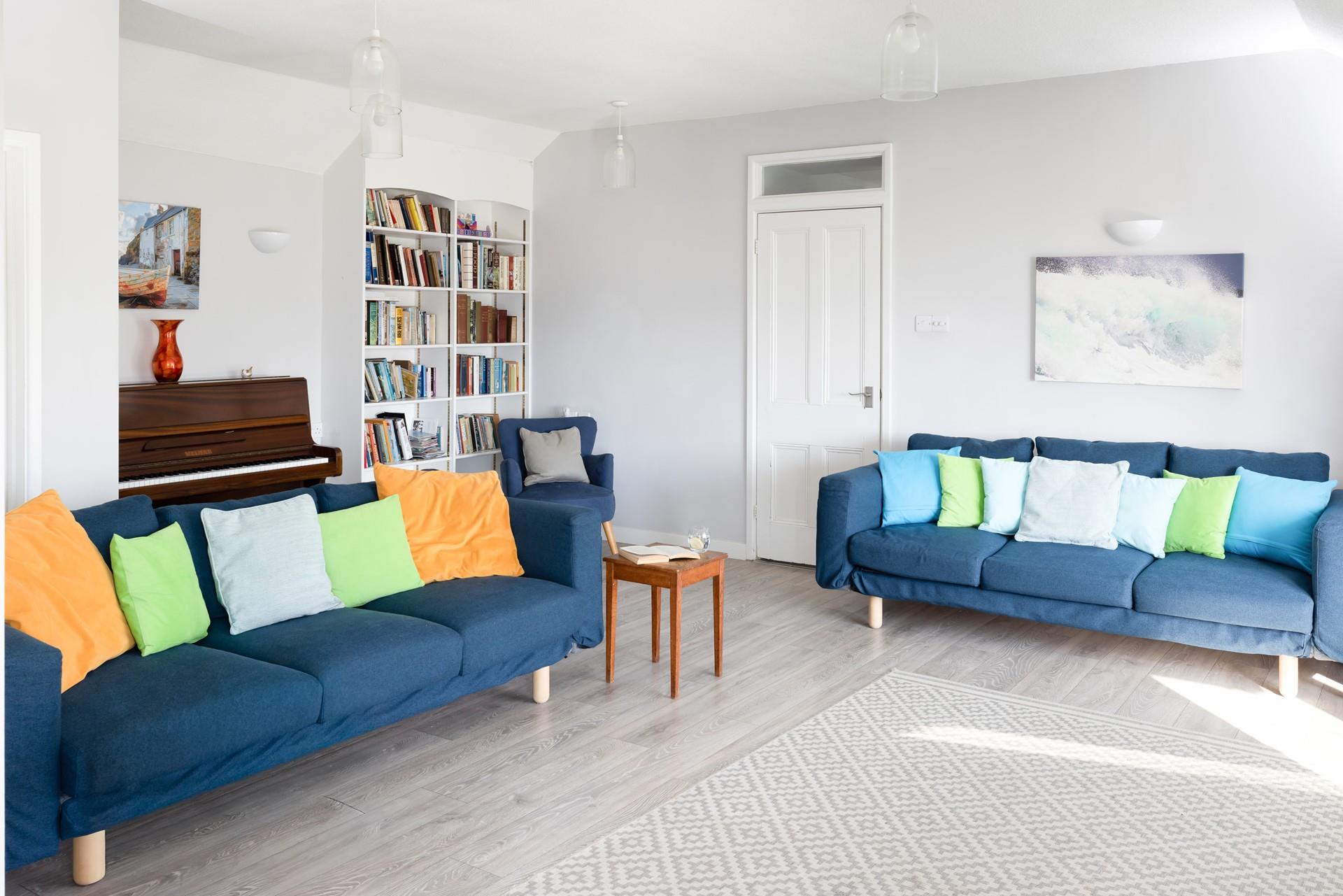 Relax in the light and bright sitting area after a day on the beach. 