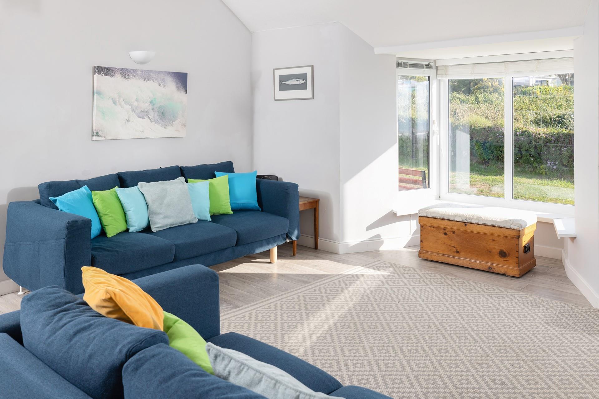 Large windows let in the Cornish sunshine.