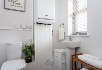 The cloakroom features a basin and WC.