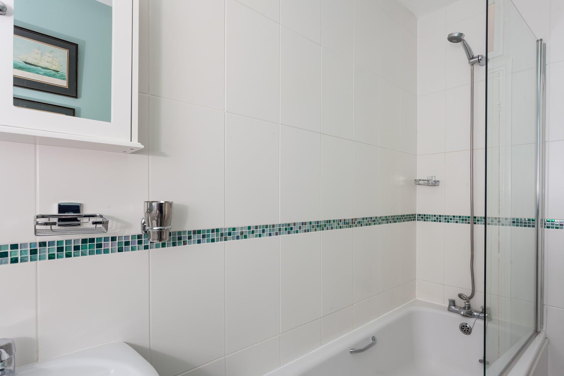 Sink into a calming bubble bath after a busy day exploring the coast path.
