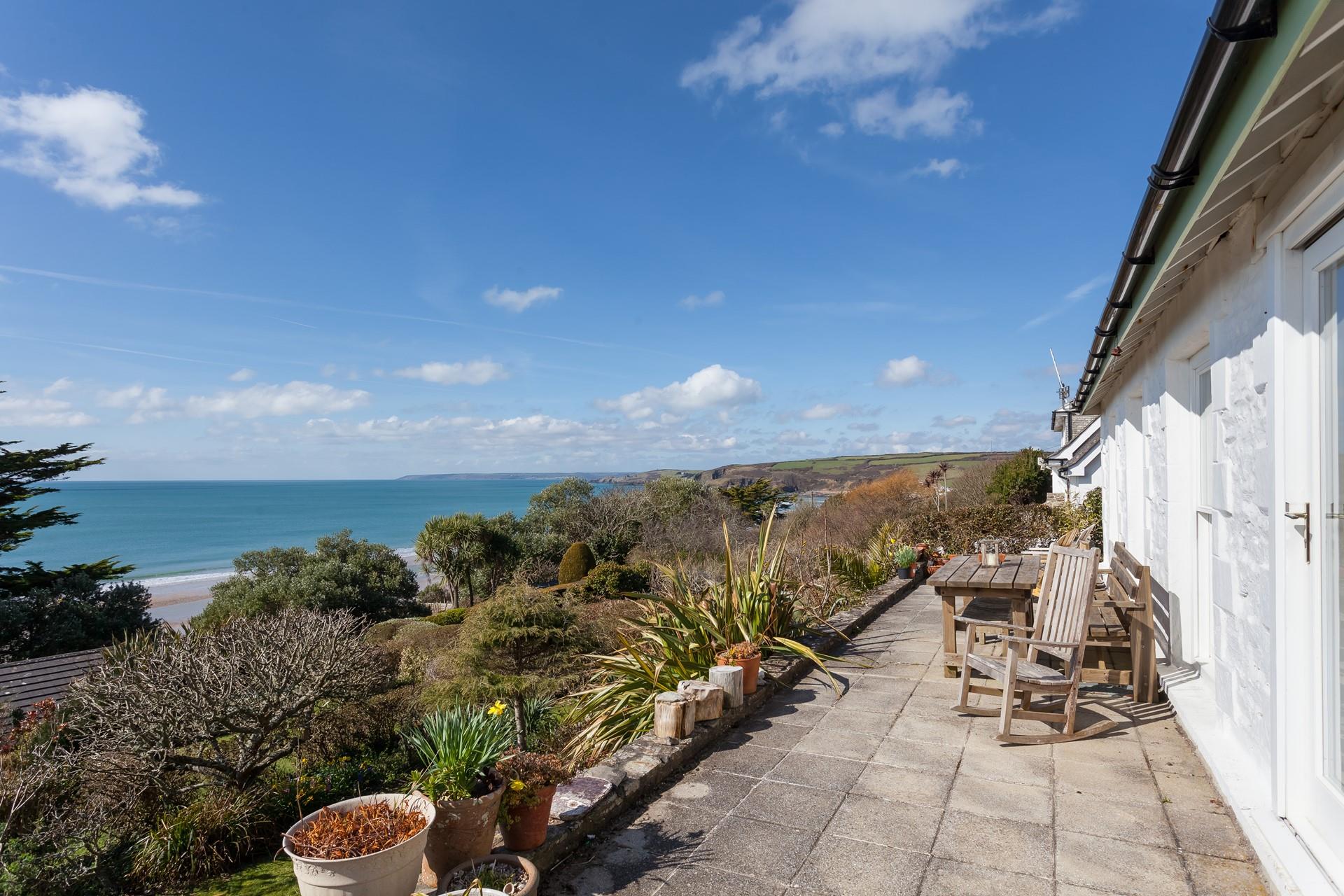 The dining room leads out onto the terrace where you will be thoroughly spoilt with postcard-worthy sea views!
