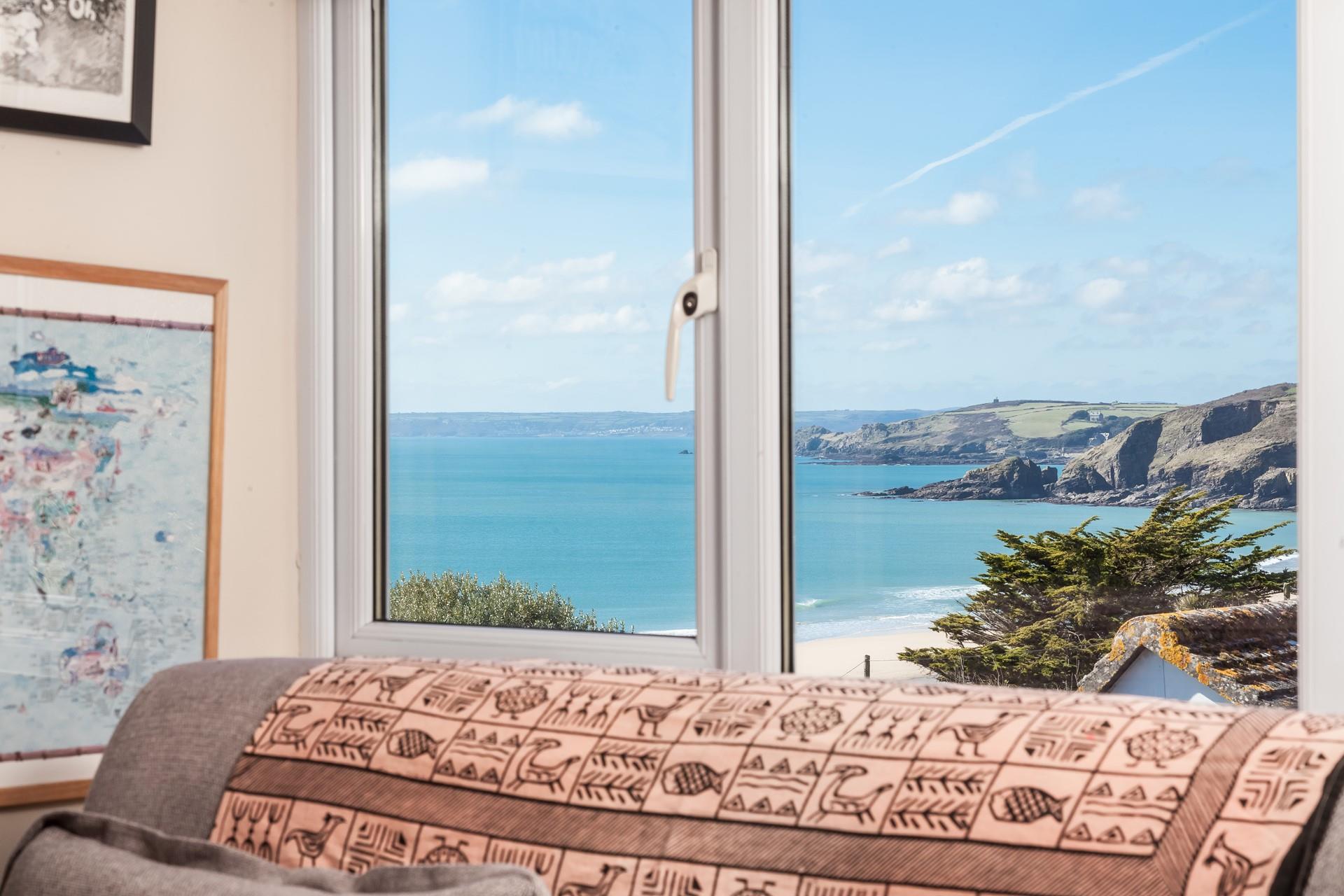 Open the window and let in the fresh air and the sounds of the sea gently lapping at the shore in the distance.