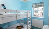 Kids will love their holiday sleepovers in the bright bunk bedroom. - Thumbnail Image
