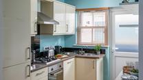 The kitchen is modern and well-equipped.